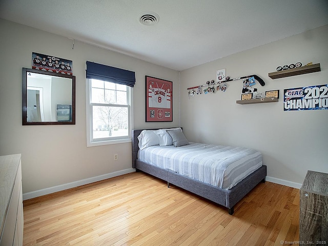 bedroom featuring hardwood / wood-style flooring