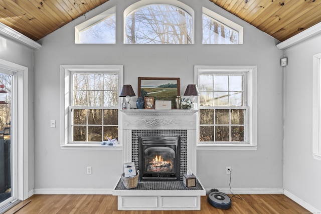 living room with lofted ceiling, light wood-type flooring, and wooden ceiling