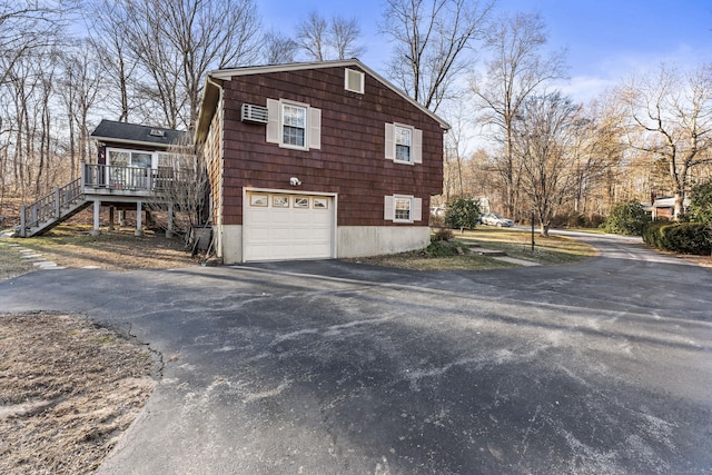 view of side of property featuring a garage