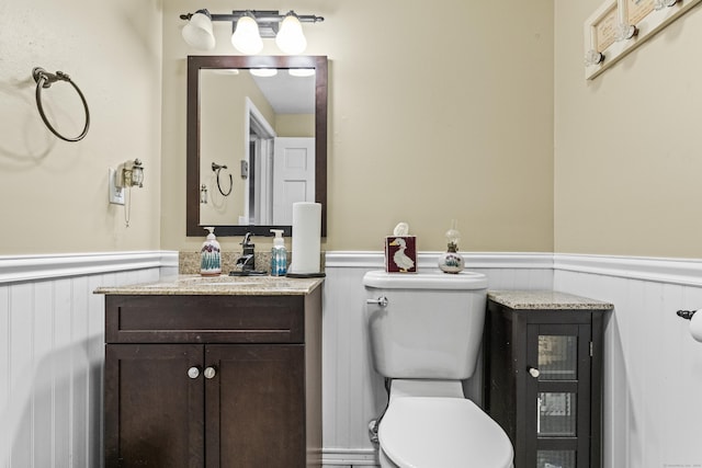 bathroom with toilet and vanity