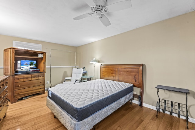 bedroom featuring ceiling fan and light hardwood / wood-style floors