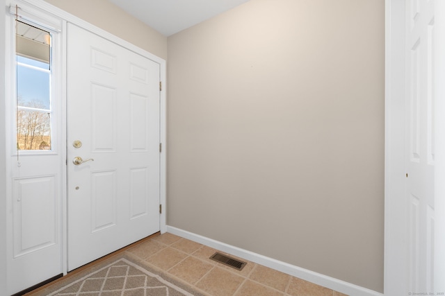 doorway to outside featuring light tile patterned floors