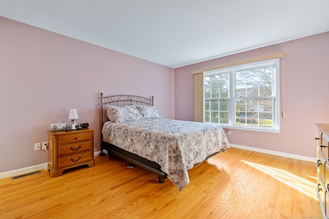 bedroom with light wood-type flooring