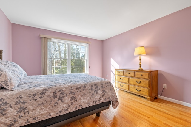 bedroom with light hardwood / wood-style flooring