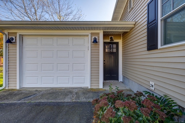 entrance to property featuring a garage