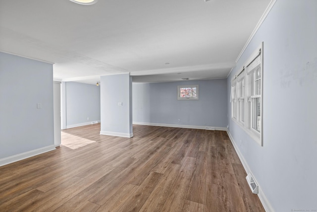 interior space featuring crown molding and wood-type flooring