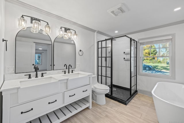 full bathroom featuring toilet, ornamental molding, plus walk in shower, and vanity