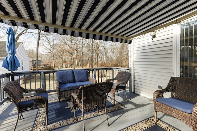 wooden deck featuring outdoor lounge area