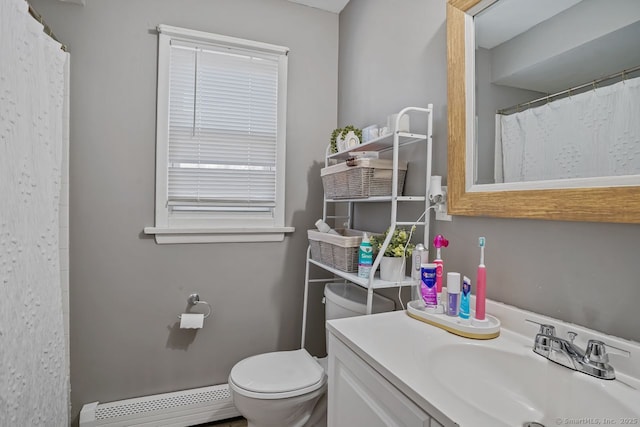 bathroom with vanity, a baseboard radiator, toilet, and curtained shower