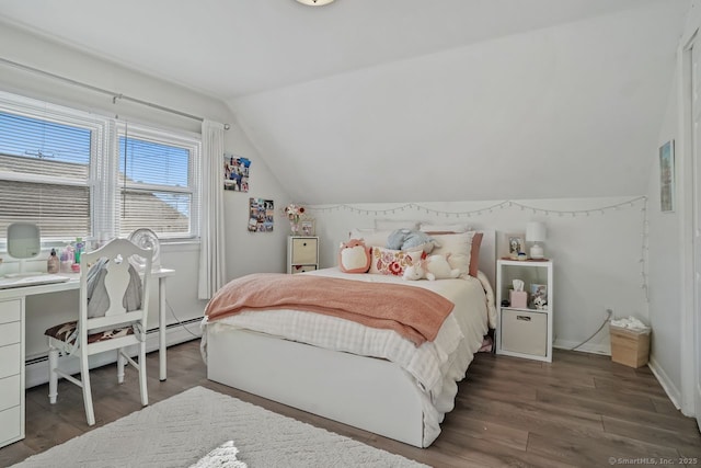 bedroom featuring a baseboard heating unit, dark wood-type flooring, and vaulted ceiling