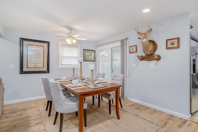 dining room featuring ceiling fan and light hardwood / wood-style flooring