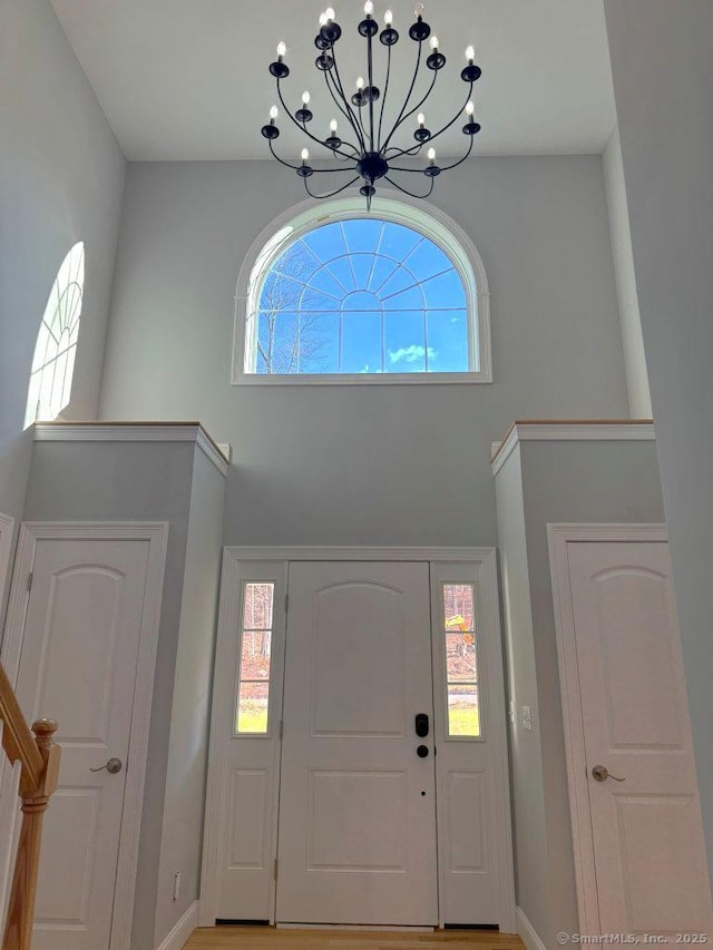 foyer with an inviting chandelier