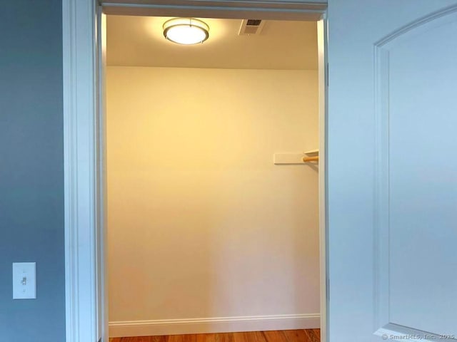 bathroom with hardwood / wood-style floors