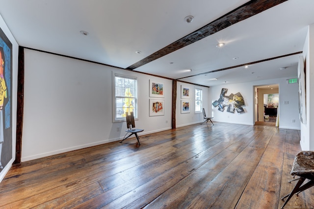 interior space featuring dark wood-type flooring and beamed ceiling