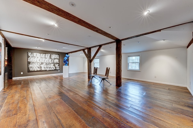 interior space featuring beam ceiling and wood-type flooring