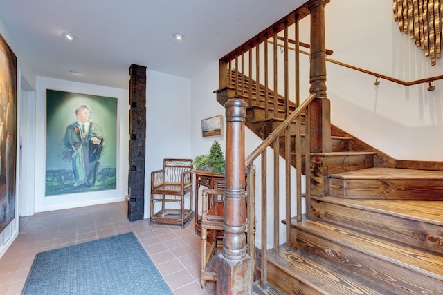 stairs with tile patterned flooring