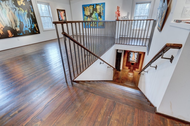 stairs with wood-type flooring