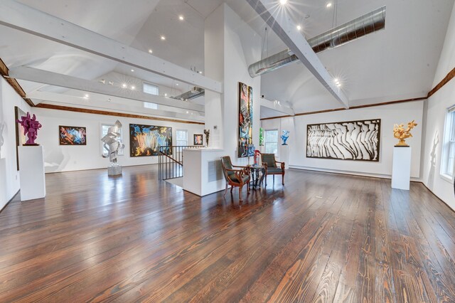 living room featuring beamed ceiling, dark hardwood / wood-style flooring, and high vaulted ceiling