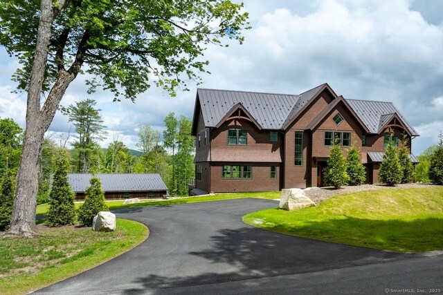 145 Taconic Rd, Salisbury, CT 06068 - view of front facade with a standing seam roof, asphalt driveway, metal roof, and a front lawn