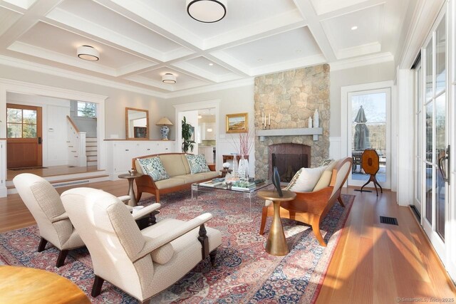 145 Taconic Rd, Salisbury, CT 06068 - living area featuring coffered ceiling, wood finished floors, stairs, beam ceiling, and a fireplace