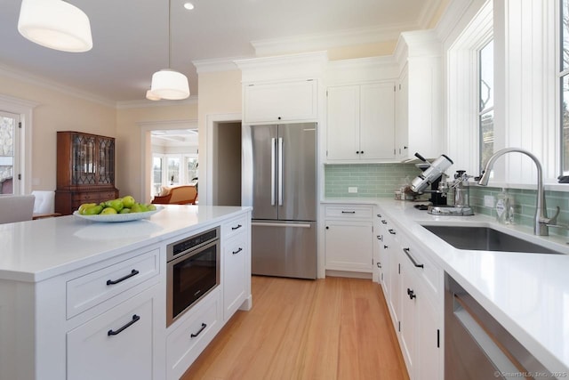 145 Taconic Rd, Salisbury, CT 06068 - kitchen with stainless steel appliances, a sink, decorative backsplash, light countertops, and white cabinets
