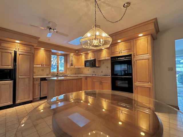 kitchen with pendant lighting, sink, decorative backsplash, ceiling fan, and black appliances