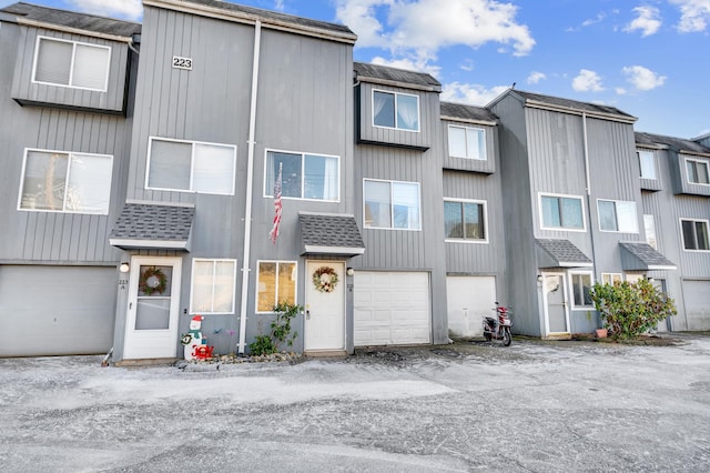 multi unit property featuring a garage