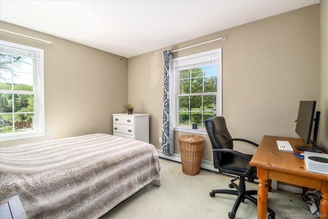 bedroom featuring carpet and baseboard heating