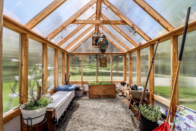 sunroom / solarium with lofted ceiling with beams