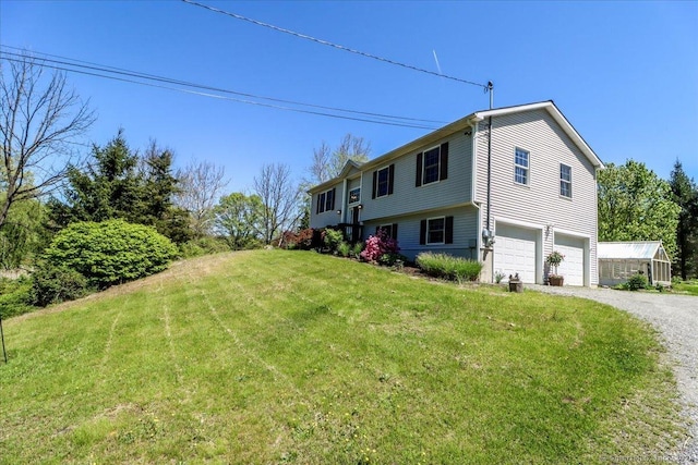 view of property exterior featuring a yard and a garage