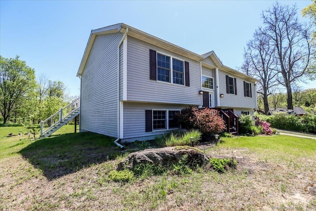 raised ranch featuring a front yard