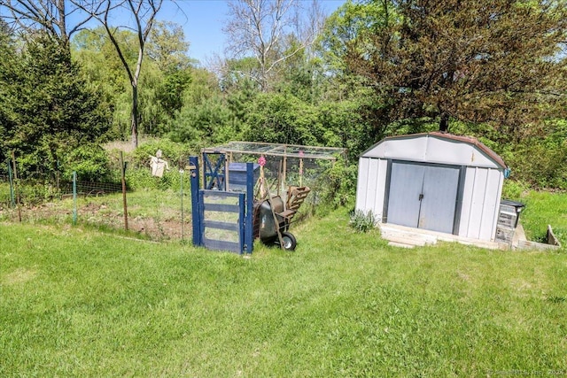 view of outbuilding with a yard