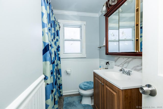 bathroom featuring crown molding, vanity, and toilet