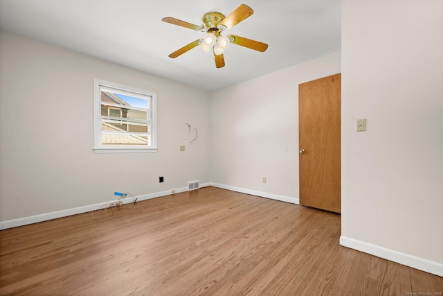 unfurnished room featuring ceiling fan and light hardwood / wood-style flooring