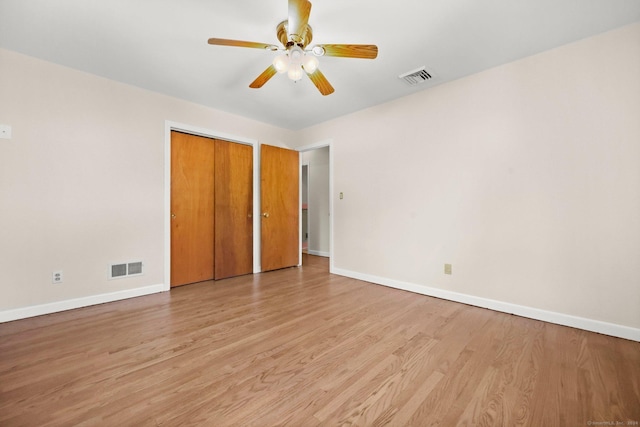 unfurnished bedroom featuring ceiling fan and light wood-type flooring