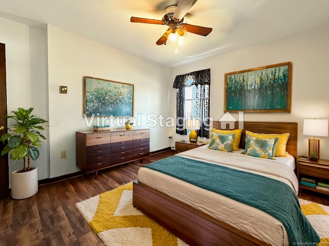 bedroom featuring ceiling fan and dark wood-type flooring