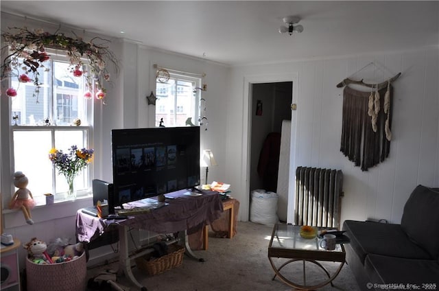 carpeted home office with radiator heating unit and ornamental molding