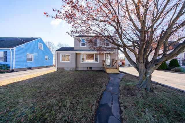 view of front of home featuring a front yard