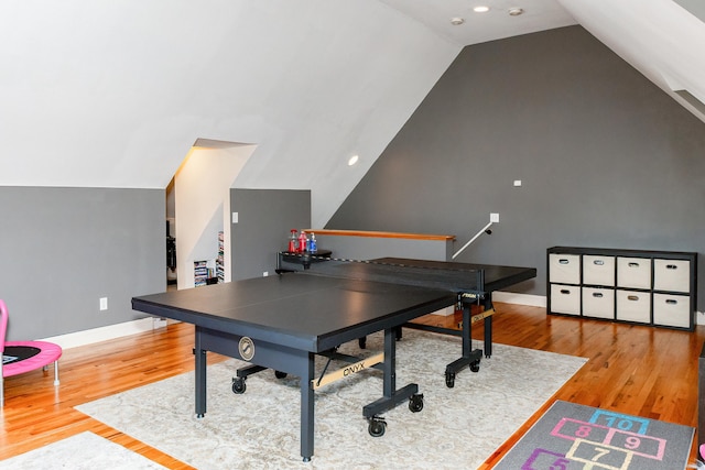 rec room featuring vaulted ceiling and hardwood / wood-style floors