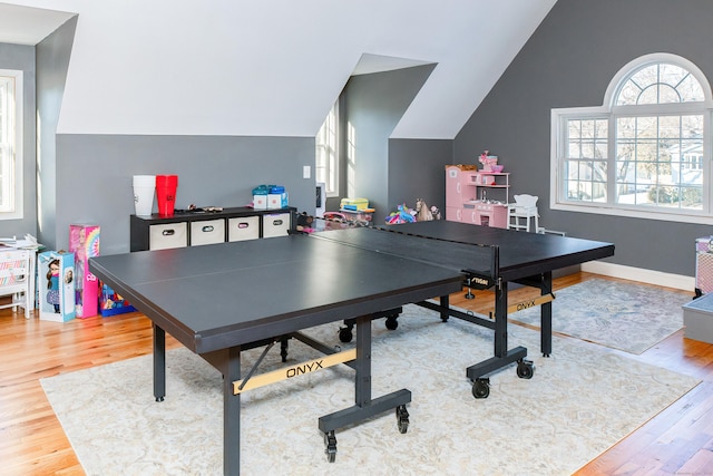 rec room featuring lofted ceiling and hardwood / wood-style floors