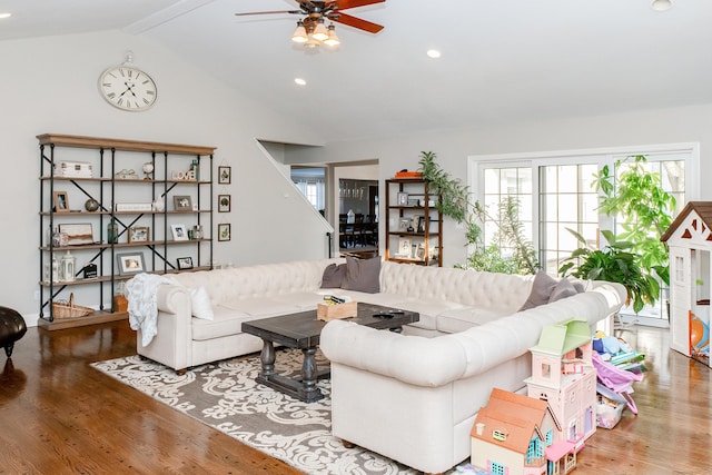 living room featuring ceiling fan, lofted ceiling, and hardwood / wood-style floors