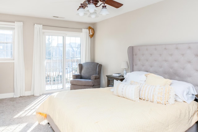 bedroom with access to exterior, ceiling fan, and carpet