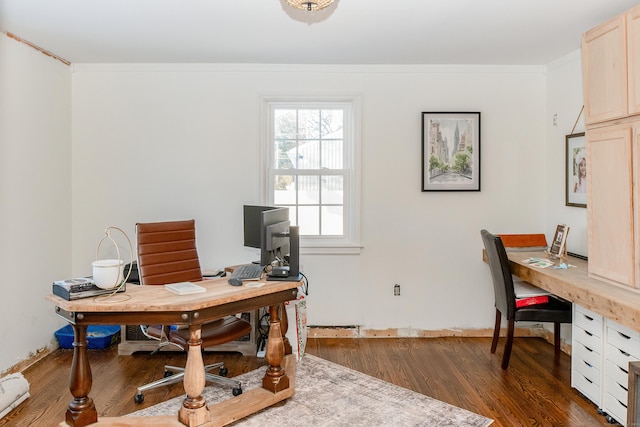 home office featuring crown molding and dark wood-type flooring