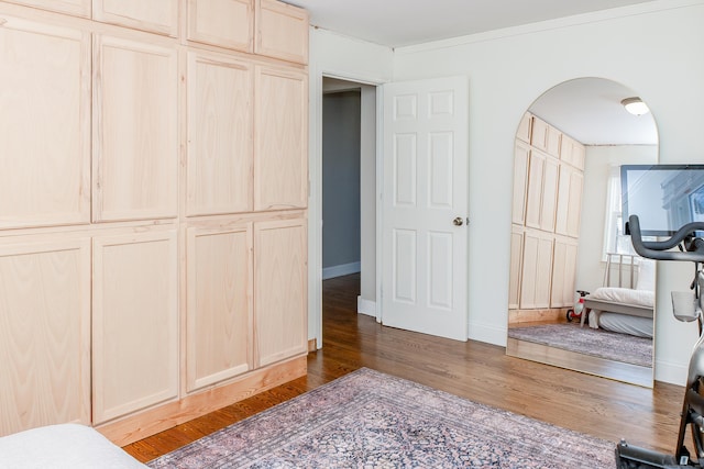 bedroom with dark wood-type flooring