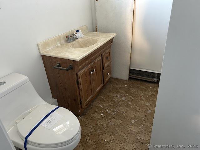 bathroom with vanity and toilet