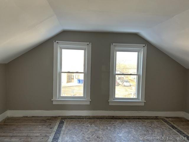 additional living space with vaulted ceiling