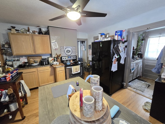 kitchen featuring stainless steel electric range, light hardwood / wood-style flooring, black fridge with ice dispenser, a textured ceiling, and light brown cabinetry