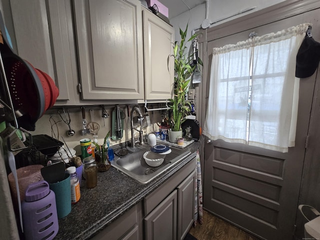 kitchen featuring sink and dark hardwood / wood-style floors