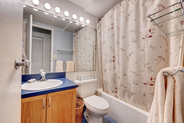 full bathroom with vanity, toilet, and shower / tub combo with curtain