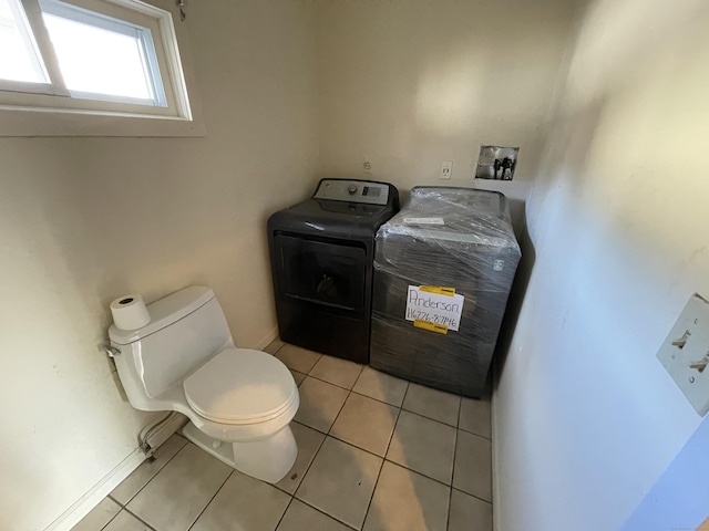 bathroom with tile patterned flooring and toilet